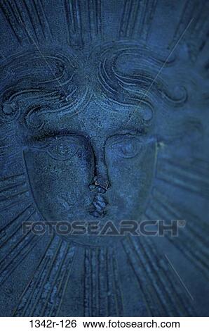 Stock Photograph - Close-up of a engraved metal shield. Fotosearch