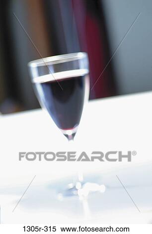 Close-up of a glass of red wine View Large Photo Image Stock Photography - Close-up of a glass of red wine. Fotosearch