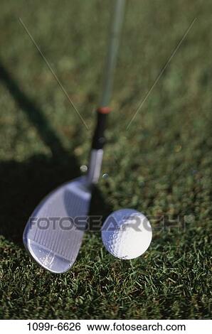 Close-up of a golf ball and a golf club View Large Photo Image Stock Photograph - Close-up of a golf ball and a golf club. Fotosearch