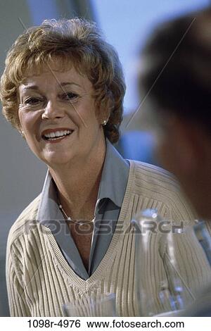 Stock Photograph - Close-up of a senior woman smiling. Fotosearch