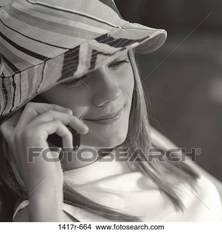 Close-up of a teenage girl talking on a mobile phone View Large Photo Image Picture - Close-up of a teenage girl talking on a mobile phone. Fotosearch