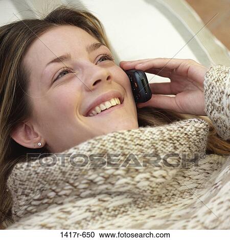 Close-up of a teenage girl talking on a mobile phone View Large Photo Image Stock Image - Close-up of a teenage girl talking on a mobile phone. Fotosearch