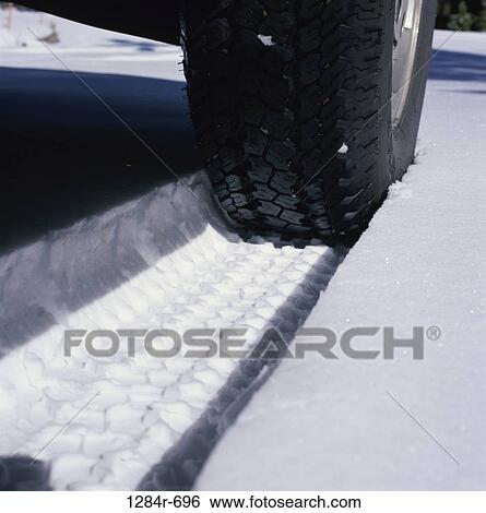 Close-up of a tire in snow View Large Photo Image Stock Photograph - Close-up of a tire in snow. Fotosearch