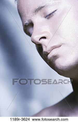 Picture - Close-up of a young man with his eyes closed. Fotosearch