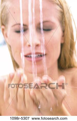 Stock Photo - Close-up of a young woman bathing. Fotosearch