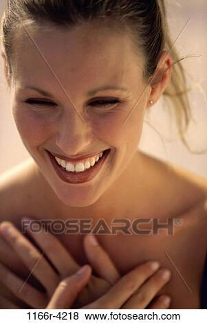 Stock Photo - Close-up of a young woman smiling. Fotosearch
