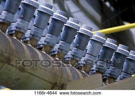 Close-up of an array of valves View Large Photo Image Picture - Close-up of an array of valves. Fotosearch