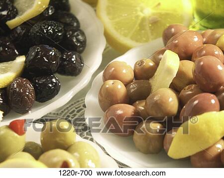Close-up of assorted olives in plates View Large Photo Image Stock Image - Close-up of assorted olives in plates. Fotosearch