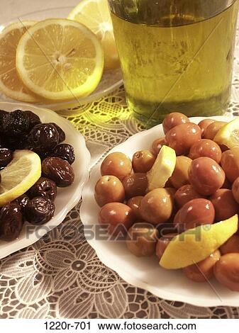 Close-up of assorted olives in plates View Large Photo Image Stock Image - Close-up of assorted olives in plates. Fotosearch