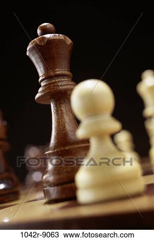 Stock Image - Close-up of chessmen on a chess board. Fotosearch