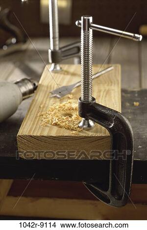 Close-up of clamps on wood View Large Photo Image Picture - Close-up of clamps on wood. Fotosearch