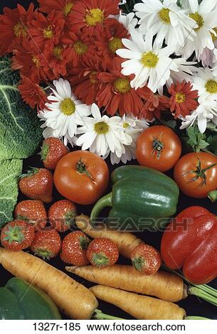 Close-up of fresh flowers with fruits and vegetables View Large Photo Image Stock Photography - Close-up of fresh flowers with fruits and vegetables. Fotosearch