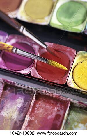 Close-up of paintbrushes over a color palette View Large Photo Image Stock Image - Close-up of paintbrushes over a color palette. Fotosearch