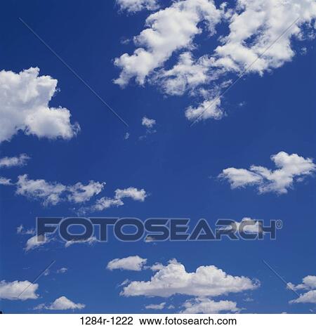 Clouds in a blue sky View Large Photo Image Stock Image - Clouds in a blue sky. Fotosearch