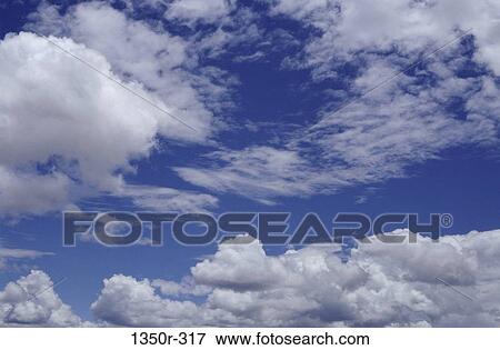 Clouds in a blue sky View Large Photo Image Stock Photo - Clouds in a blue sky. Fotosearch
