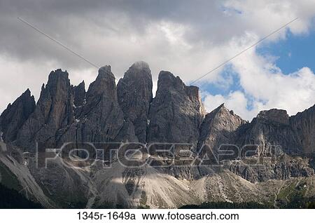 Clouds over mountain range, Geisler Gruppe, Funes Valley, Dolomites, Trentino-Alto-Adige, Italy View Large Photo Image Stock Image - Clouds over mountain range, Geisler Gruppe, Funes Valley, Dolomites, Trentino-Alto-Adige, Italy. Fotosearch