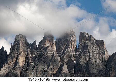 Clouds over mountain range, Geisler Gruppe, Funes Valley, Dolomites, Trentino-Alto-Adige, Italy View Large Photo Image Stock Image - Clouds over mountain range, Geisler Gruppe, Funes Valley, Dolomites, Trentino-Alto-Adige, Italy. Fotosearch