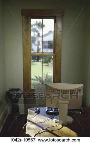 Computer monitor in front of a window View Large Photo Image Stock Photo - Computer monitor in front of a window. Fotosearch