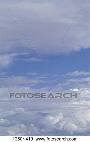Cumulus clouds in a blue sky View Large Photo Image Stock Photo - Cumulus clouds in a blue sky. Fotosearch