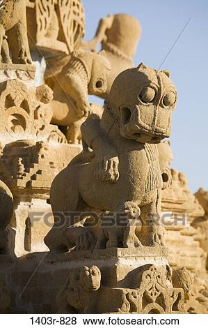 Detail of a carved statue on the tower of the Jain Temple at Jaisalmer Fort, Rajasthan, India View Large Photo Image Stock Photo - Detail of a carved statue on the tower of the Jain Temple at Jaisalmer Fort, Rajasthan, India. Fotosearch