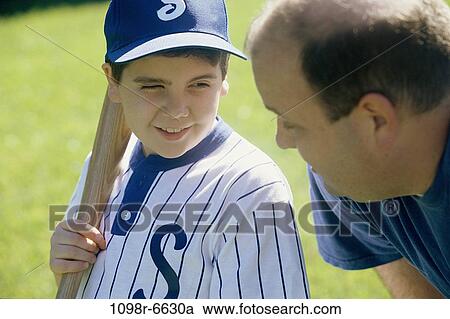 Stock Image - Father and son playing baseball. Fotosearch