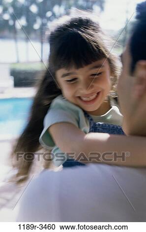 Father carrying his daughter View Large Photo Image Stock Image - Father carrying his daughter. Fotosearch