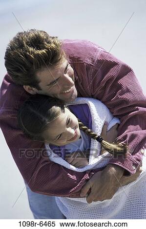 Stock Photography - Father hugging his daughter. Fotosearch