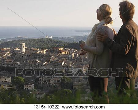 France, Vance, Couple looking over townscape and French Riviera View Large Photo Image Stock Image - France, Vance, Couple looking over townscape and French Riviera. Fotosearch
