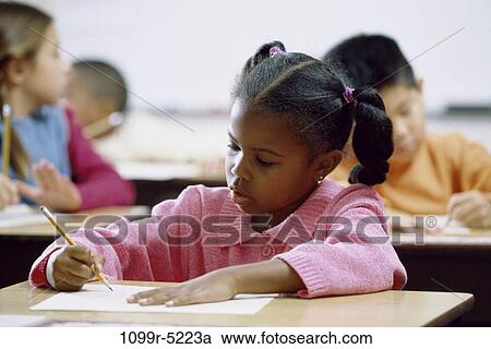 Girl writing on paper with a pencil View Large Photo Image Stock Image - Girl writing on paper with a pencil. Fotosearch