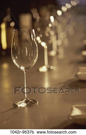 Glasses in a row on a bar View Large Photo Image Stock Image - Glasses in a row on a bar. Fotosearch