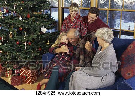 Stock Photography - Grandfather hugging his granddaughter. Fotosearch