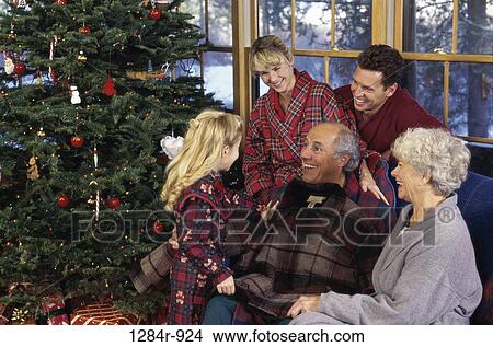 Grandfather laughing with his granddaughter View Large Photo Image Picture - Grandfather laughing with his granddaughter. Fotosearch