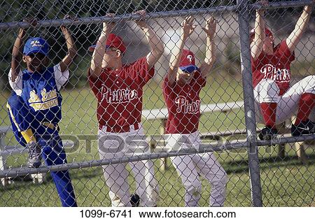 Group of children climbing a chain-link fence View Large Photo Image Stock Image - Group of children climbing a chain-link fence. Fotosearch