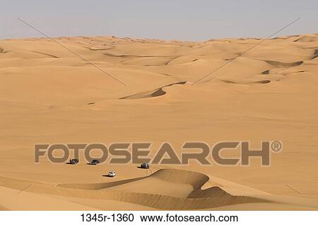 High angle view of 4x4 vehicles in a desert, Erg Awbari, Fezzan, Libya View Large Photo Image Stock Image - High angle view of 4x4 vehicles in a desert, Erg Awbari, Fezzan, Libya. Fotosearch