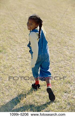Stock Photograph - High angle view of a girl running. Fotosearch