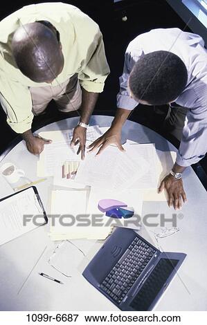High angle view of business executives in an office View Large Photo Image Stock Photo - High angle view of business executives in an office. Fotosearch