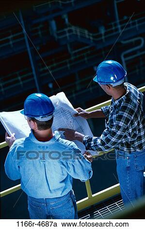High angle view of two foremen holding blueprints View Large Photo Image Stock Image - High angle view of two foremen holding blueprints. Fotosearch