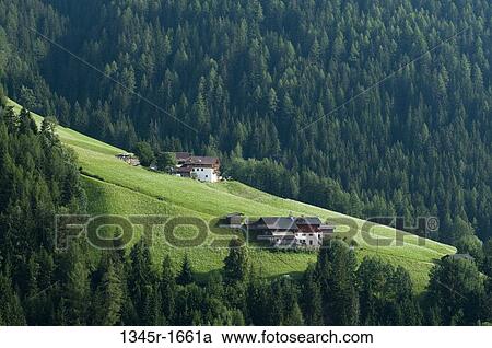 Stock Image - Houses on a landscape, Santa Maddalena, Funes Valley, Dolomites, Trentino-Alto-Adige, Italy. Fotosearch