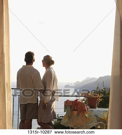 Italy, Amalfi, Couple look out from hotel suite over positano View Large Photo Image Stock Photo - Italy, Amalfi, Couple look out from hotel suite over positano. Fotosearch