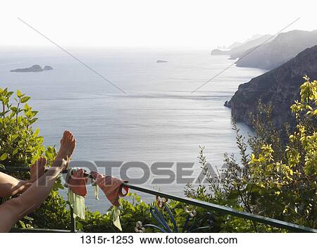 Italy, Campania, Amalfi Peninsula, Positano, Feet reclining on railing View Large Photo Image Stock Image - Italy, Campania, Amalfi Peninsula, Positano, Feet reclining on railing. Fotosearch