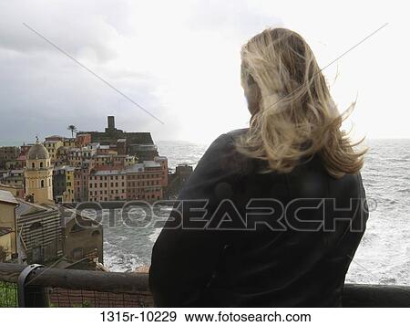 Italy, Liguria, Cinque Terre, Vernazza, Woman watching at town View Large Photo Image Stock Photo - Italy, Liguria, Cinque Terre, Vernazza, Woman watching at town. Fotosearch