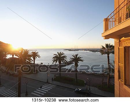 Stock Photo - Italy, Liguria, Rapallo, Waterfront area at sunrise. Fotosearch