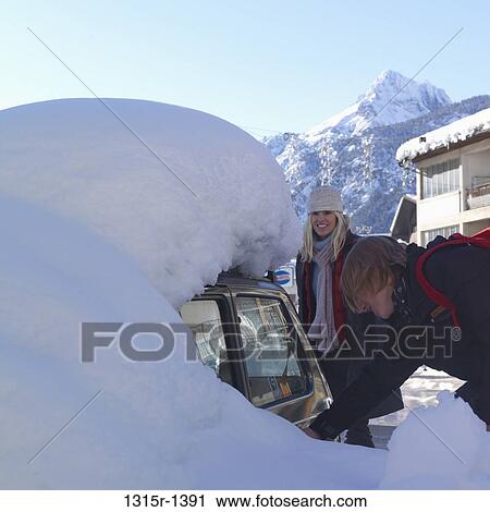 Italy, Piedmont, Bardonecchia, teenage boy and mother entering car buried under snow View Large Photo Image Stock Image - Italy, Piedmont, Bardonecchia, teenage boy and mother entering car buried under snow. Fotosearch