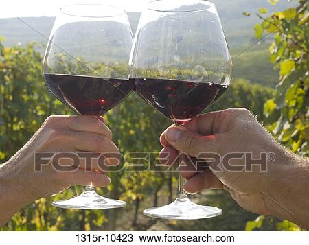 Italy, Piedmont, Barolo, Couple toasting with wine glasses in vineyard View Large Photo Image Stock Image - Italy, Piedmont, Barolo, Couple toasting with wine glasses in vineyard. Fotosearch