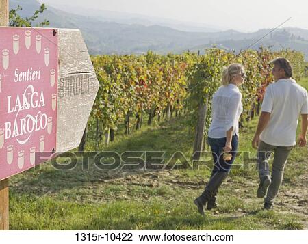 Italy, Piedmont, Barolo, Couple walking through wine country View Large Photo Image Stock Image - Italy, Piedmont, Barolo, Couple walking through wine country. Fotosearch