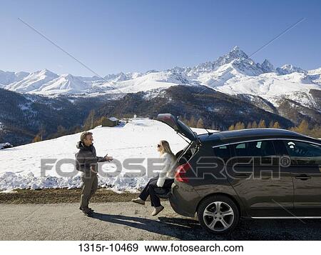 Italy, Piedmont, Couple resting in back of car on mountain road View Large Photo Image Stock Photo - Italy, Piedmont, Couple resting in back of car on mountain road. Fotosearch