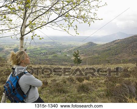 Italy, Piedmont, female backpacker looking at view in countryside View Large Photo Image Stock Image - Italy, Piedmont, female backpacker looking at view in countryside. Fotosearch