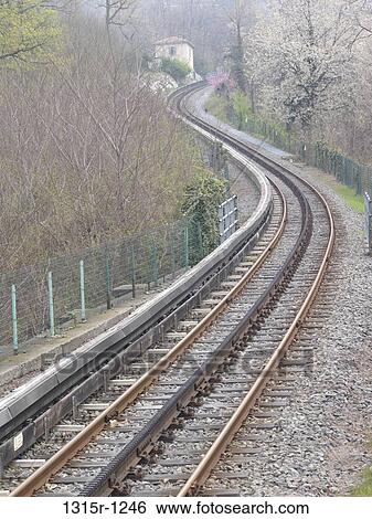 Italy, Piedmont, Funicular tracks climbing through forest in early spring View Large Photo Image Stock Photograph - Italy, Piedmont, Funicular tracks climbing through forest in early spring. Fotosearch