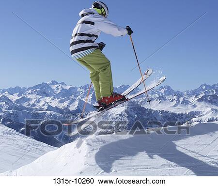 Italy, Piedmont, Jafferau, Teenage skier jumps over snowy ridgecrest View Large Photo Image Stock Image - Italy, Piedmont, Jafferau, Teenage skier jumps over snowy ridgecrest. Fotosearch