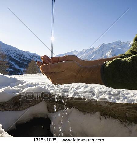 Italy, Piedmont, Man's hands scooping water from running spout in high mountain meadow View Large Photo Image Stock Image - Italy, Piedmont, Man's hands scooping water from running spout in high mountain meadow. Fotosearch